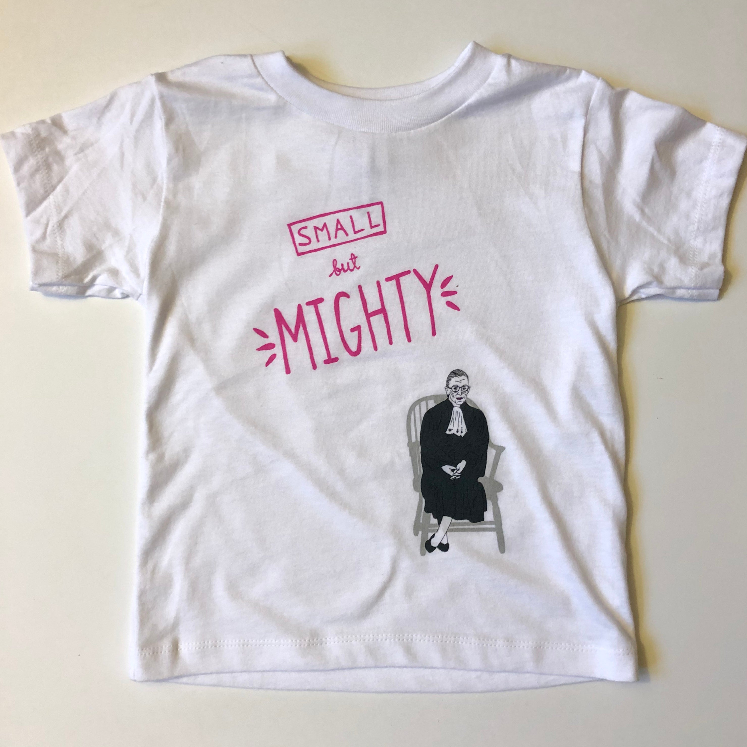 RBG Small but Mighty Toddler T-Shirt featuring an original illustration of Ruth Bader Ginsburg, made from soft cotton, available in sizes 2T-5T.